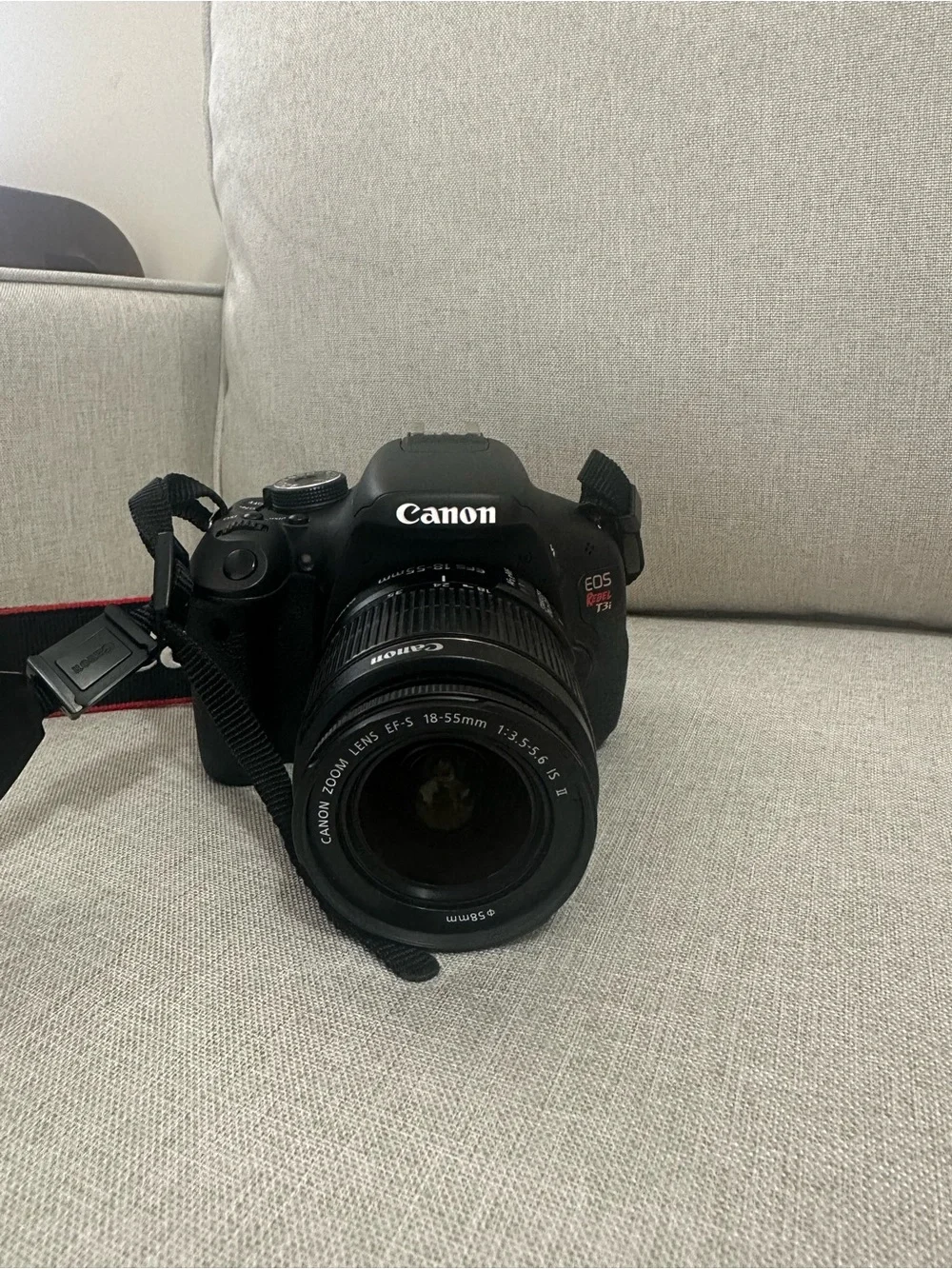 Canon DSLR Camera in Black with Red-Trim Strap